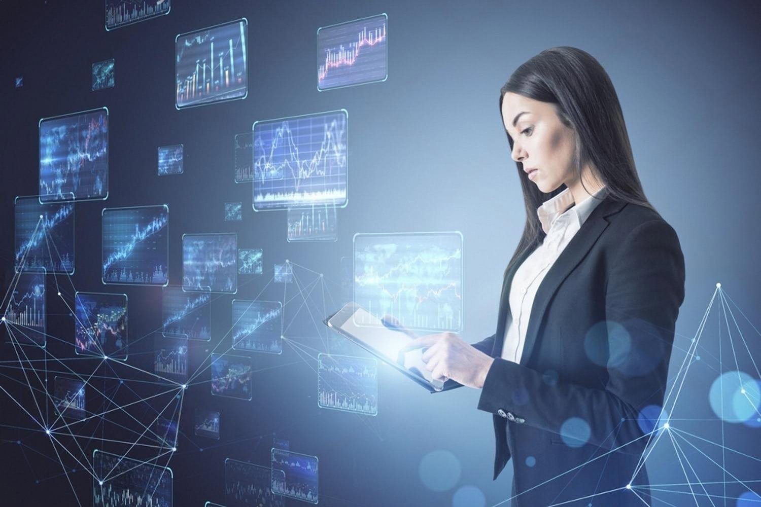 HR professional reviewing candidate data on a tablet with floating analytics screens